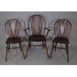 A set of eight 20th century stained beech wheelback dining chairs, to include two carvers, (8).