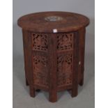 A 20th century North African bone inlaid sandlewood occasional table on folding base,