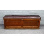 A late 19th Century oak porch coffer, with lifting leather padded seat,