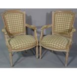A pair of 20th century limed wood armchairs, with checkered upholstery, (2).