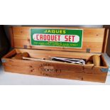 Jacques; a 20th century croquet set within a pine case, 110cm wide x 19cm high.