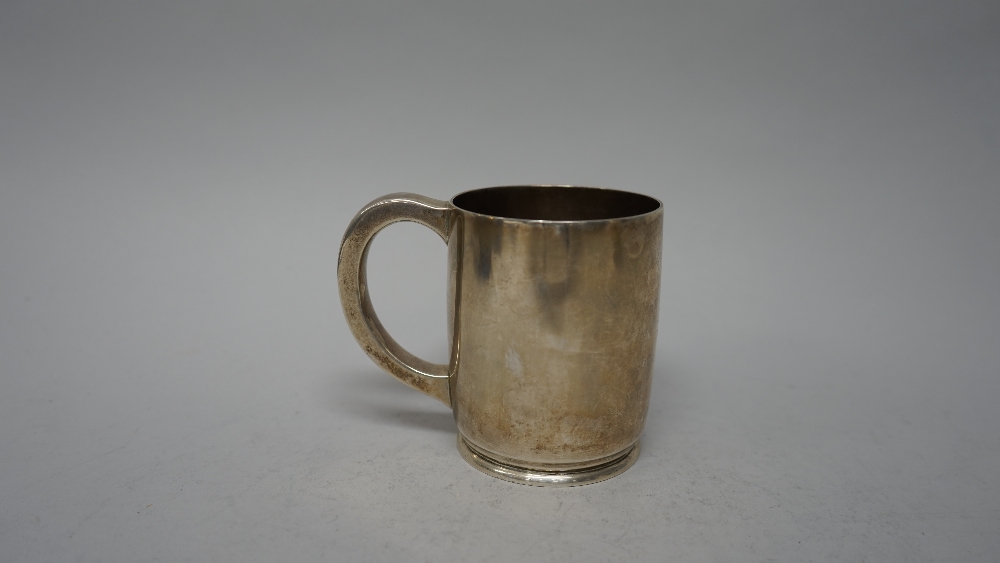 A silver mug, of plain cylindrical form,