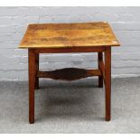 An 18th century oak rectangular side table on tapering square supports united by shaped stretcher,