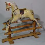 An early 20th century painted rocking horse, (a.f.), 100cm wide x 98cm high.