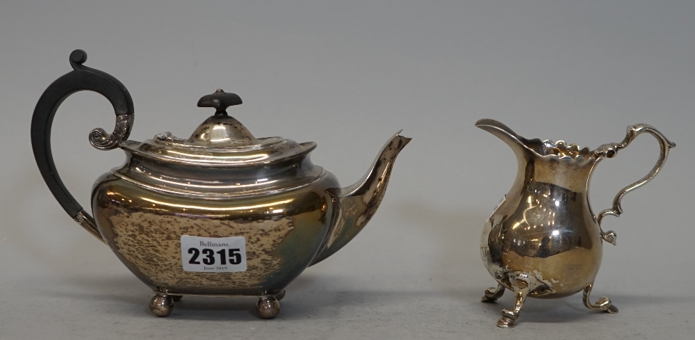 A silver bachelor's teapot, of compressed squat form, with scroll handle, Sheffield 1906,