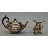 A silver bachelor's teapot, of compressed squat form, with scroll handle, Sheffield 1906,