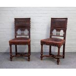 A set of eight 19th century French walnut studded embossed leather upholstered dining chairs on