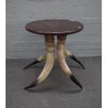 After Anthony Redmile; a 20th century occasional table on four horn supports,