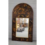 A large black and gilt chinoiserie decorated mirror, of arched rectangular form, 76cms wide,