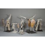 In the manner of Eduardo Paolozzi, a quantity of plaster moulded hands and legs,