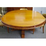 Ralph Lauren; a 20th century oak circular extending dining table on four fluted square columns,