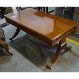 A Regency style mahogany rectangular coffee table on duel end supports 106cm wide x 52cm high.