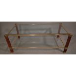 A 20th century two tier glass, brass rectangular coffee table, 108cm wide x 38cm high.