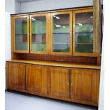 A large Biedermeier cherrywood and part ebonised library bookcase,