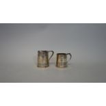 A Victorian silver mug, of tapered cylindrical form with reeded banding, monogram engraved,
