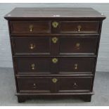 A late 17th century oak chest of four long moulded drawers on block feet, 98cm wide x 105cm high.