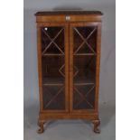 A George III style mahogany bookcase on shell capped cabriole supports 61cm wide x 123cm high.