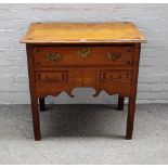 An early 18th Century oak lowboy,