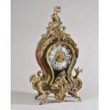 A Louis XV style boulle work bracket clock of waisted form, with cherub finial,