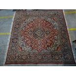 A Persian carpet, 232cm x 238cm.