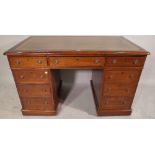 A late 19th century oak pedestal desk with tooled green leather top, 126cm wide x 72cm high.