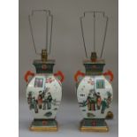 A pair of modern Chinese vase table lamps each decorated with Oriental figures,