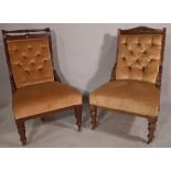 A late Victorian mahogany low armchair and another similar, (2).
