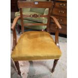 A set of four Regency mahogany bar back dining chairs to include one carver, (4).