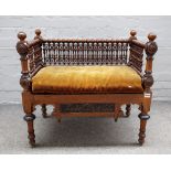 A late 19th century North African bench with extensive bobbin turned decoration,