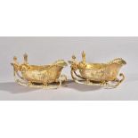 A pair of late Victorian silver gilt sauceboats of novelty "sleigh" form,