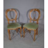 A set of 20th century beech spoonback dining chairs.