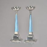 A pair of George V silver and pale blue enamelled candlesticks,