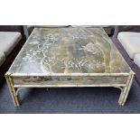 A large 20th century faux bamboo square coffee table, painted with birds in a river scene,