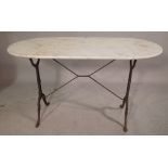 A 20th century oval marble top table, on cast iron base, 120cm wide x 72cm high.