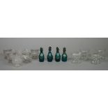 Four coloured glass condiment bottles and stoppers, 19th century, of bluish-green tone,