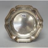 A European dish of shaped circular form, engraved with an armorial within a reeded rim,