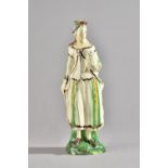 A rare creamware figure of a shepherdess, circa 1780,