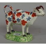 A pearlware cow creamer and cover, possibly Cambrian Pottery, Swansea, circa 1820-30,