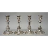 A set of four Sheffield plated telescopic action table candlesticks,