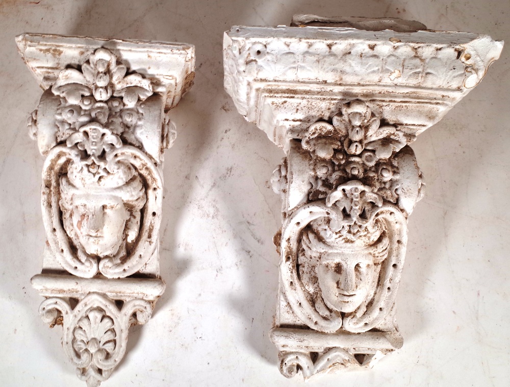 A similar pair of early 20th century plaster corbels with mask decoration, 46cm high. - Image 2 of 2