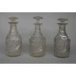 A set of three Regency cut glass decanters and stoppers, early 19th century,