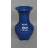 A Moorcroft powder blue pottery vase of baluster form, impressed mark to base, 31cm high.