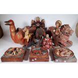 A quantity of mostly 20th century hardwood carved eastern collectables items, (qty.).