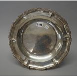 A Mexican main course dish, of shaped circular form, decorated with a gadrooned rim,