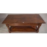 A 20th century oak rectangular coffee table with undertier 122cm wide x 48cm high.