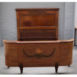 A 19th Century French walnut marquetry inlaid and ormolu mounted double bedstead,