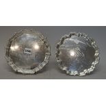 A silver salver, of shaped circular form, having a gadrooned and shell capped border,