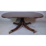 A Regency style mahogany coffee table with rounded rectangular top on four down swept supports,