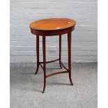 A George III mahogany, harewood and satinwood oval work table,