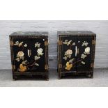 A pair of 20th century hardstone mounted ebonised two door side cabinets, on block feet,